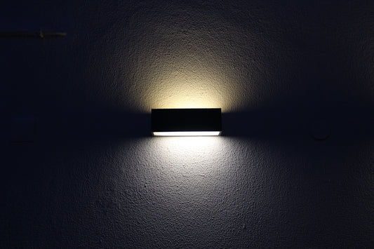 rectangular black sconces with dim light