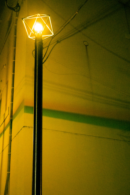 a lamp post with a light on top of it