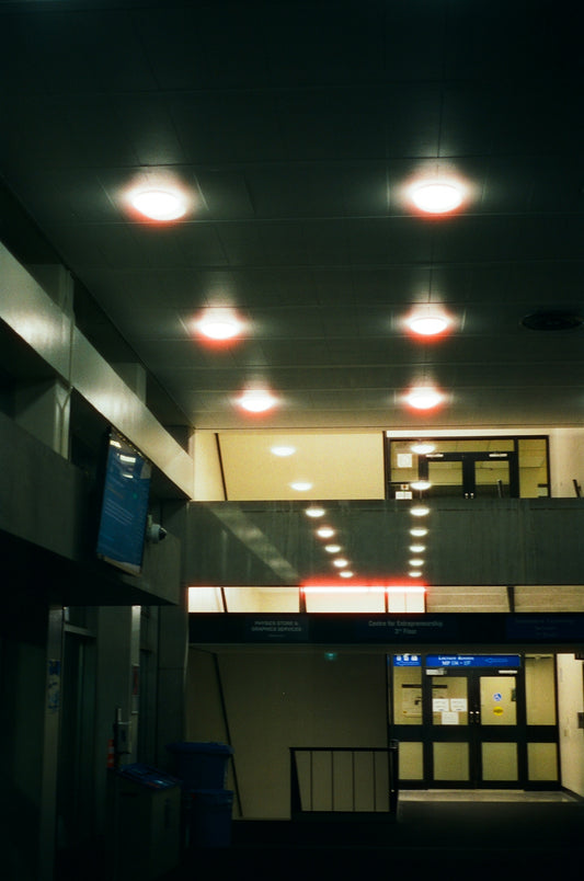 An empty building with lights on the ceiling